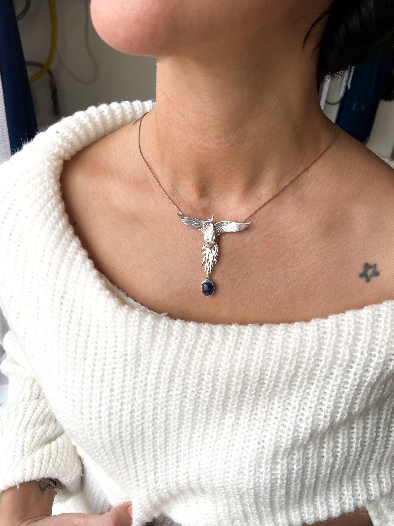 Silver Lapis Lazuli Phoenix Strength Necklace, Sapphire Stone or Root Lapis Lazuli Stone Sapphire or Root Ruby Eyes Pure Silver Our phoenix is ​​925 sterling silver and it is completely handcrafted. The eyes you see on it are decoratedSilver Lapis Lazuli