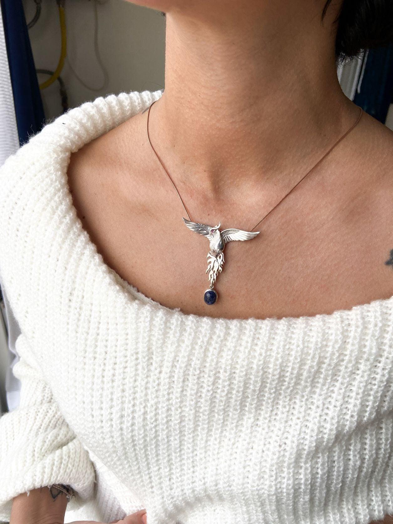 Silver Lapis Lazuli Phoenix Strength Necklace, Sapphire Stone or Root Lapis Lazuli Stone Sapphire or Root Ruby Eyes Pure Silver Our phoenix is ​​925 sterling silver and it is completely handcrafted. The eyes you see on it are decoratedSilver Lapis Lazuli