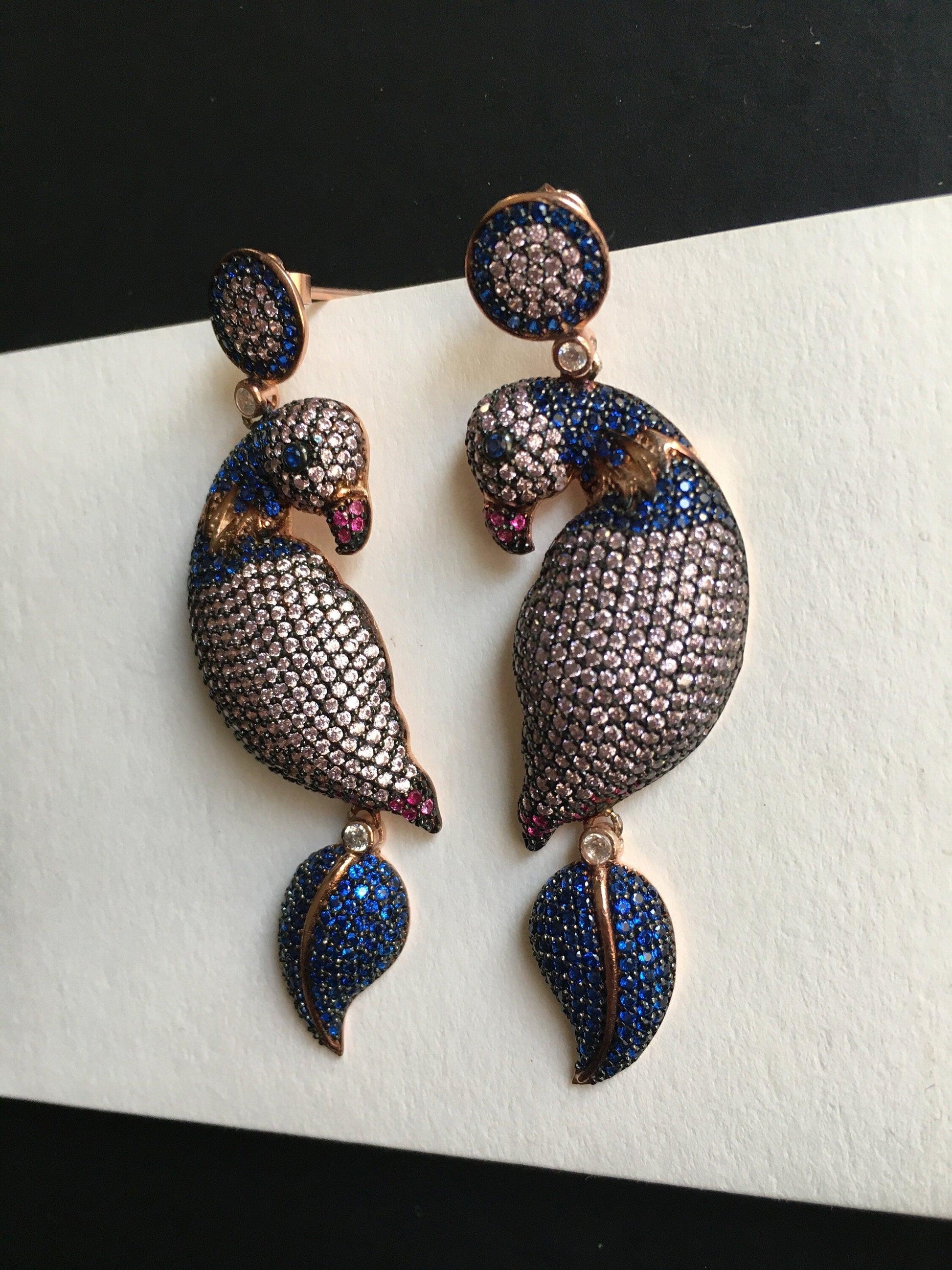 Silver Parrot Stud Earrings, Desing Parrot Colored Handmade Earrings, Custom Desing Colored Parrot is 925 sterling silver Earrings and it is completely handcrafted.Stone is zircon gemstone.The stones on it are first quality zircon.cuttSilver Parrot Stud Earrings