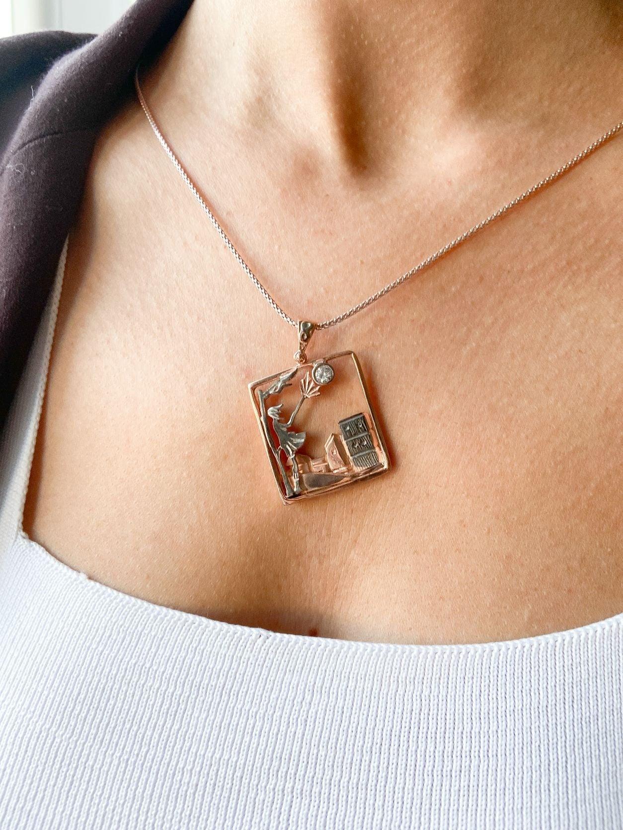 Windy Weather Rose Gold 3-D Necklace, Girl and Stormy City Holding Umb925 Sterling Silver Windy Weather Rose Gold 3-D Necklace For Women.
A girl is carrying an umbrella fighting against the wind. The city is in the background and the gWindy Weather Rose Gold