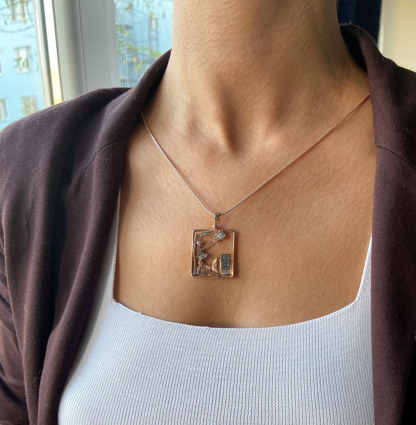 Windy Weather Rose Gold 3-D Necklace, Girl and Stormy City Holding Umb925 Sterling Silver Windy Weather Rose Gold 3-D Necklace For Women.
A girl is carrying an umbrella fighting against the wind. The city is in the background and the gWindy Weather Rose Gold
